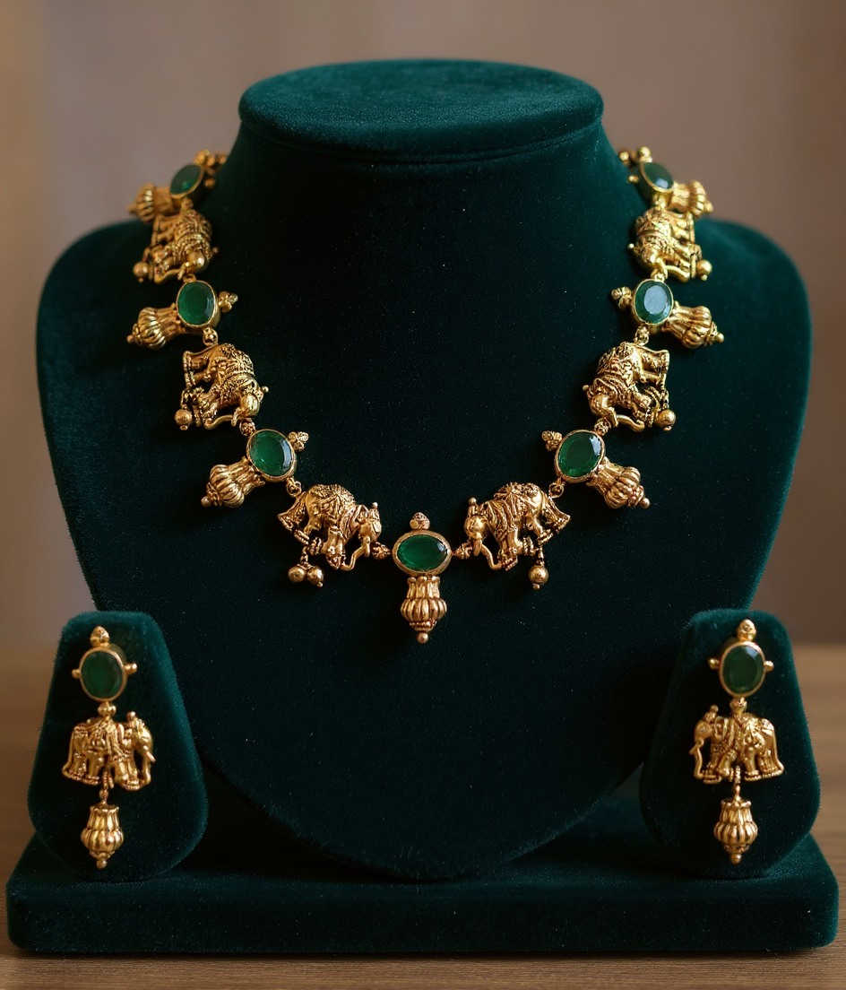 Gold Necklace Embedded With Natural Emeralds With A Unique Temple Jewellery Based On Elephants