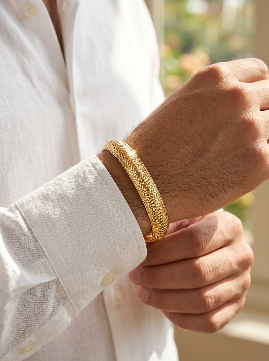 City gold-plated Kada bracelet features a textured, diamond-cut surface pattern view 2